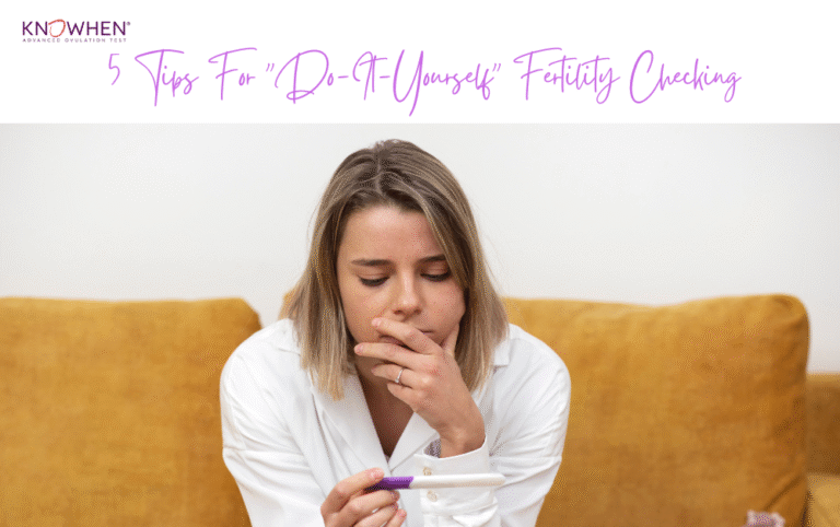 Woman tracking ovulation at home using a fertility chart and saliva test kit.